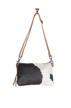 Load image into Gallery viewer, Sublime Cow Print Hand Tooled Purse
